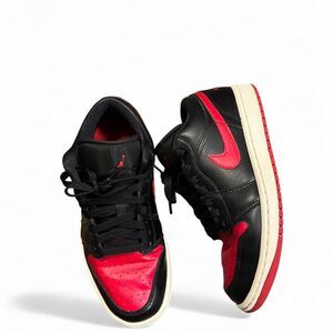 Nike Air Jordan 1 low sneakers. Women’s 7.5. Red and black colorway.